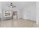 Inviting living room features tile floors, ceiling fan, and bright windows at 1411 Di Blasi Dr # 104, Las Vegas, NV 89119