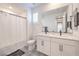 Bathroom showcasing black fixtures, decorative tile flooring, and a double sink vanity at 201 Carmel Sky St, Las Vegas, NV 89138