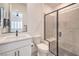 Bathroom featuring white cabinets, a black-framed shower, and decorative tile flooring at 201 Carmel Sky St, Las Vegas, NV 89138