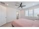 Bright bedroom with ceiling fan, carpet, and ensuite access at 201 Carmel Sky St, Las Vegas, NV 89138