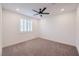 Bedroom boasts carpet flooring, a window with shutters, and a modern ceiling fan at 201 Carmel Sky St, Las Vegas, NV 89138