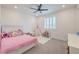 Bedroom including a play area with a teepee and a pink bed covered in stuffed animals at 201 Carmel Sky St, Las Vegas, NV 89138