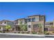 A modern two-story home with a two-car garage, and desert landscaping at 201 Carmel Sky St, Las Vegas, NV 89138