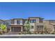 Two-story home featuring modern design elements, a two-car garage and manicured landscaping at 201 Carmel Sky St, Las Vegas, NV 89138