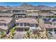 Beautiful single-Gathering home featuring a red tiled roof, desert landscaping, and mountain views at 201 Carmel Sky St, Las Vegas, NV 89138