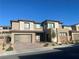 Contemporary two-story home featuring a brick driveway, desert landscaping, and an attached two-car garage at 201 Carmel Sky St, Las Vegas, NV 89138