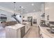 Modern kitchen featuring a large island, stainless steel appliances, and seamless open floor plan at 201 Carmel Sky St, Las Vegas, NV 89138