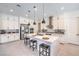 Beautiful kitchen with a large marble island, stainless steel appliances, and white cabinets at 201 Carmel Sky St, Las Vegas, NV 89138