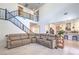 Spacious living room open to the kitchen, featuring a staircase and modern decor at 201 Carmel Sky St, Las Vegas, NV 89138