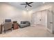 The modern home office includes neutral decor, a ceiling fan, and frosted glass doors at 201 Carmel Sky St, Las Vegas, NV 89138