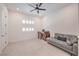 Bright home office with a ceiling fan, shutters, modern furniture, and ample natural light at 201 Carmel Sky St, Las Vegas, NV 89138