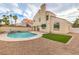 Backyard pool and patio combination with green turf and mature landscaping at 2107 Fountain Springs Dr, Henderson, NV 89074