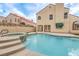 Backyard pool with mature landscaping and covered patio at 2107 Fountain Springs Dr, Henderson, NV 89074