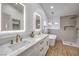 Beautiful bathroom with double sinks, a soaking tub, and a separate shower with elegant finishes at 2107 Fountain Springs Dr, Henderson, NV 89074