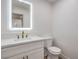 Contemporary half bath features a lighted mirror, modern fixtures, and updated vanity at 2107 Fountain Springs Dr, Henderson, NV 89074