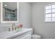 Modern bathroom features a vanity with gold fixtures, marble counters, a shower, and a window at 2107 Fountain Springs Dr, Henderson, NV 89074