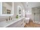 Elegant bathroom with double vanity, free-standing tub, and glass-enclosed shower at 2107 Fountain Springs Dr, Henderson, NV 89074