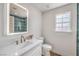 Stylish bathroom features an LED mirror, modern vanity, and stand up shower with beautiful tile at 2107 Fountain Springs Dr, Henderson, NV 89074