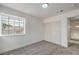 Bright bedroom featuring neutral carpet, base trim, and a closet with sliding doors at 2107 Fountain Springs Dr, Henderson, NV 89074