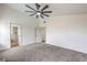 Bright bedroom with large windows, contemporary ceiling fan, and ensuite bathroom access at 2107 Fountain Springs Dr, Henderson, NV 89074