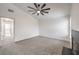 Bright bedroom with carpet, a modern ceiling fan, fireplace, and an ensuite bathroom at 2107 Fountain Springs Dr, Henderson, NV 89074