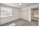 Bright bedroom with neutral carpet, fresh white paint, one window, and closet at 2107 Fountain Springs Dr, Henderson, NV 89074