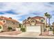 Charming two-story home with a tile roof, well-maintained landscaping, and a two-car garage at 2107 Fountain Springs Dr, Henderson, NV 89074