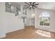 Bright living room with high ceilings, ceiling fan, a staircase, and hardwood flooring at 2107 Fountain Springs Dr, Henderson, NV 89074