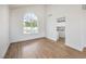 Open living room featuring hardwood floors and views of the pool area at 2107 Fountain Springs Dr, Henderson, NV 89074