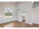 Living area with a view of the pool, wood floors, and white walls at 2107 Fountain Springs Dr, Henderson, NV 89074