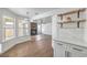 Open-concept floor plan features a cozy fireplace, wood floors, and ample natural light at 2107 Fountain Springs Dr, Henderson, NV 89074