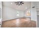 Bright living room with vaulted ceilings, a ceiling fan, and wood-look floors at 2107 Fountain Springs Dr, Henderson, NV 89074