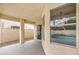 Covered outdoor patio with a door and window overlooking the pool area at 2107 Fountain Springs Dr, Henderson, NV 89074