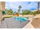 Backyard pool with a spa, stone accents, and ample patio space, ideal for entertaining in a private setting at 2107 Fountain Springs Dr, Henderson, NV 89074