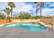 Inviting backyard pool and spa, surrounded by lush landscaping and secure fencing for privacy and leisure at 2107 Fountain Springs Dr, Henderson, NV 89074
