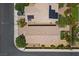 An aerial view shows the tile roofs and solar panels of homes in this residential neighborhood at 2276 Sky Island Dr, Henderson, NV 89002