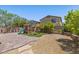 Backyard features a playground, patio, and landscaping for outdoor fun at 2276 Sky Island Dr, Henderson, NV 89002
