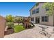 Great backyard featuring a brick patio, play structure, and a view of the home at 2276 Sky Island Dr, Henderson, NV 89002