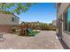 Enjoy the backyard with a brick patio, play structure, and green turf at 2276 Sky Island Dr, Henderson, NV 89002