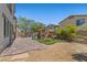 A backyard with a brick patio, a play structure for , and plenty of space to run around at 2276 Sky Island Dr, Henderson, NV 89002