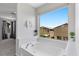 Primary bathroom showcasing a large soaking tub with view to the neighborhood at 2276 Sky Island Dr, Henderson, NV 89002