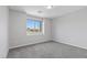 Minimalist bedroom featuring neutral walls, carpet and a clear window view at 2276 Sky Island Dr, Henderson, NV 89002