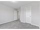 Bright bedroom featuring neutral walls, carpet, and two doors at 2276 Sky Island Dr, Henderson, NV 89002