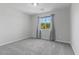 Empty bedroom with neutral gray walls, carpeted floor and a window at 2276 Sky Island Dr, Henderson, NV 89002