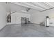 Spacious garage with epoxy floors and storage shelving, ready for vehicles and projects at 2276 Sky Island Dr, Henderson, NV 89002