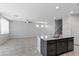 Open floor plan featuring a kitchen island with seating and stainless steel appliances at 2276 Sky Island Dr, Henderson, NV 89002