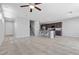 Open-concept living space with tiled floors, and a modern kitchen with a central island at 2276 Sky Island Dr, Henderson, NV 89002