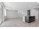 Open-concept living space with an island and tiled floors provides ample room to entertain at 2276 Sky Island Dr, Henderson, NV 89002