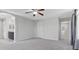 Spacious main bedroom with a ceiling fan, ensuite bathroom, and plush carpet at 2276 Sky Island Dr, Henderson, NV 89002