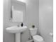 Elegant powder room featuring a pedestal sink and modern fixtures at 2276 Sky Island Dr, Henderson, NV 89002